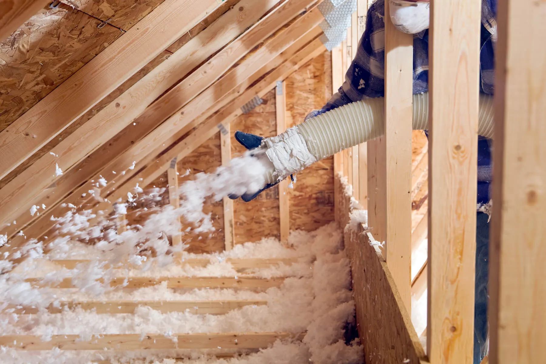 Spray foam being applied to a roof deck